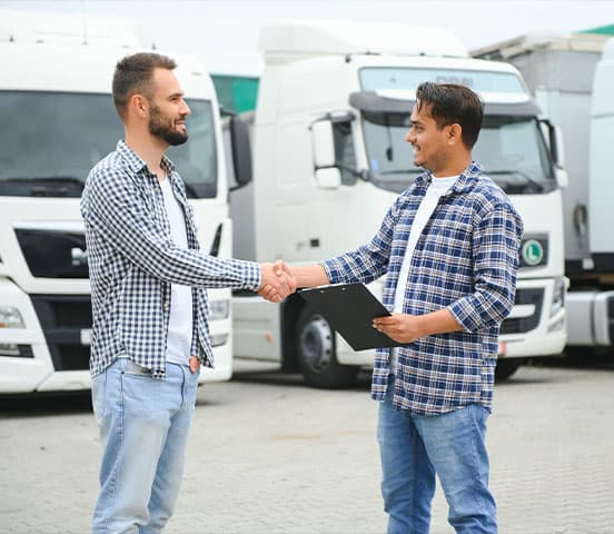 Business customer discussing a courier trading account beside delivery vehicles