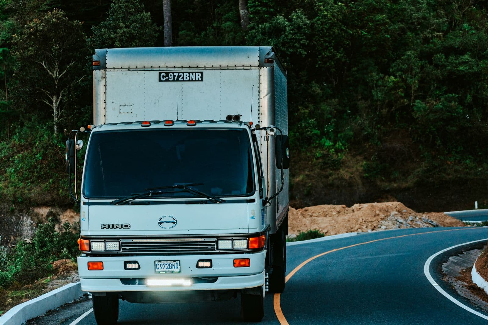 Dedicated courier vehicle travelling on a UK road for an urgent London collection