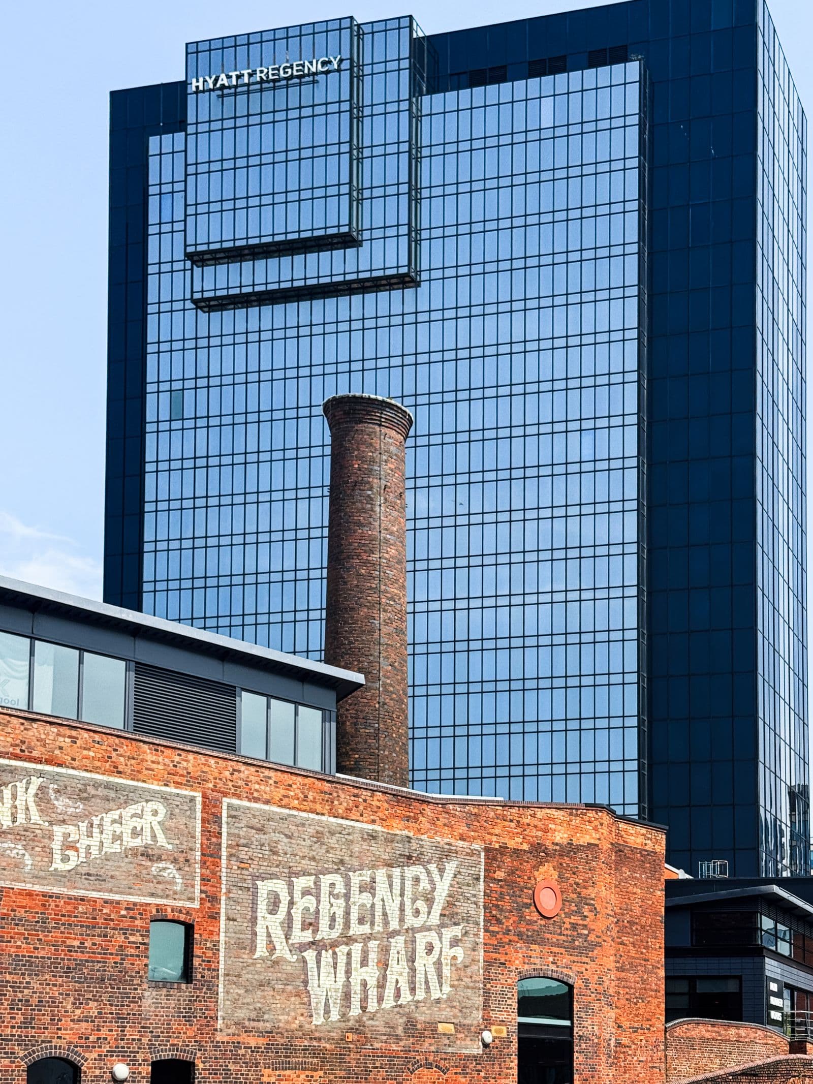 Regency Wharf chimney and modern glass tower in central Birmingham