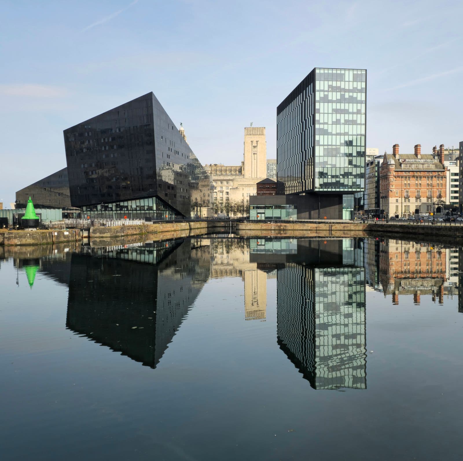 Modern buildings reflected in the water at Liverpool waterfront