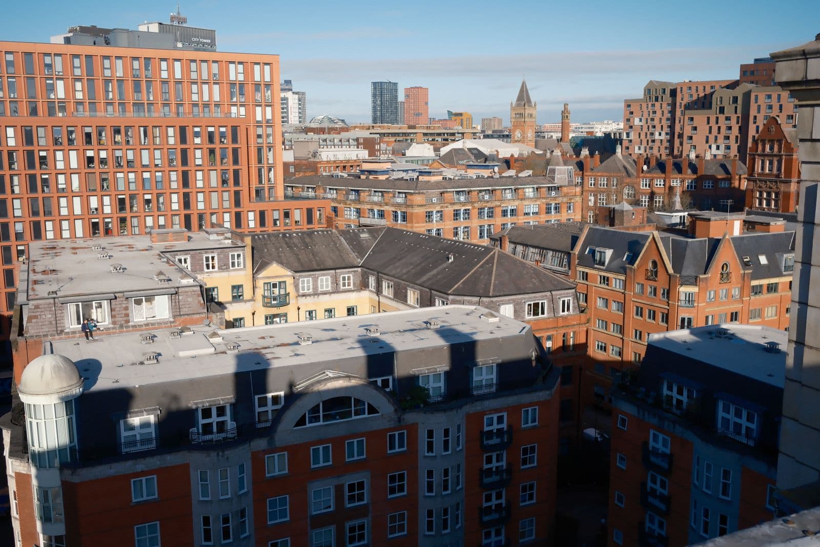 Manchester city centre skyline with red-brick buildings and modern towers