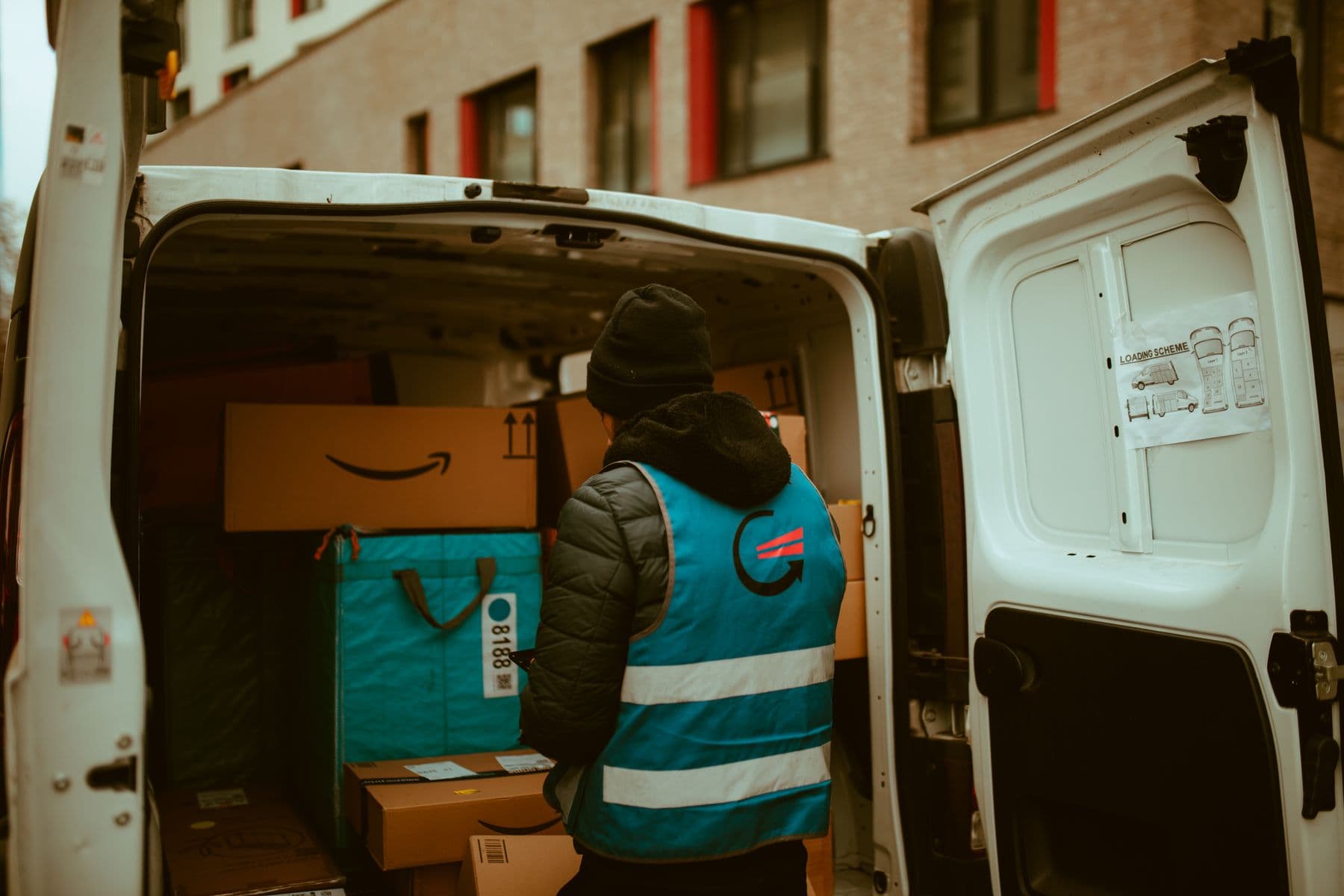 Dedicated courier driver preparing a commercial vehicle